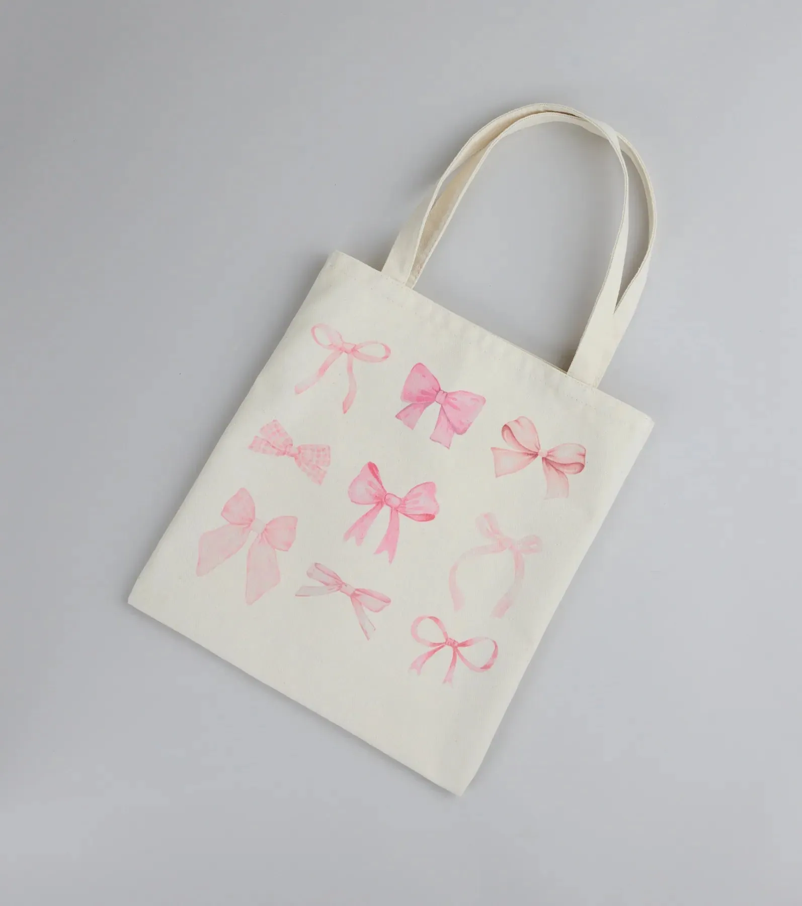 About A Girl Bow Canvas Tote Bag sold by Windsor