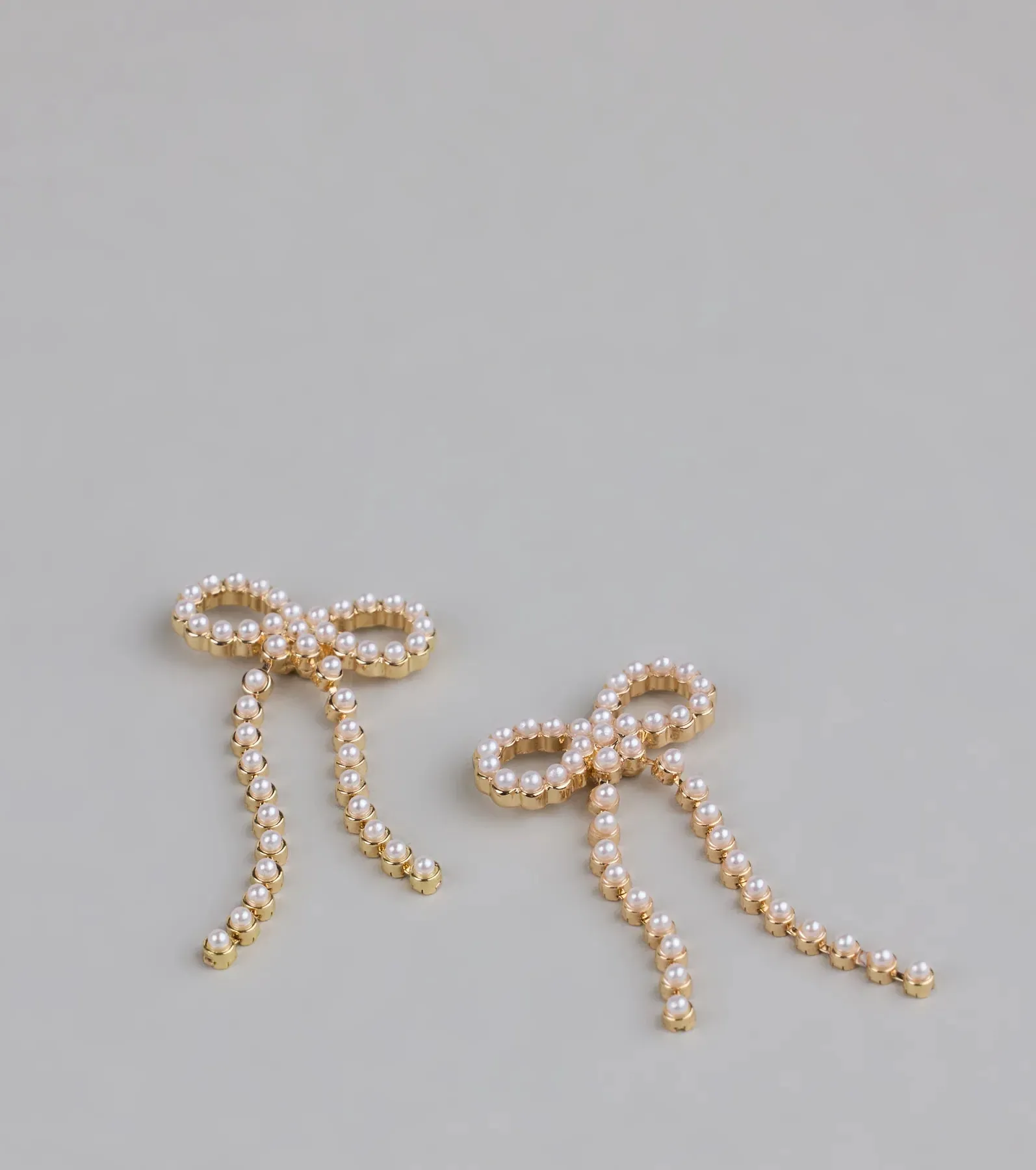 Dainty Poise Faux Pearl Bow Earrings sold by Windsor product image thumbnail 2