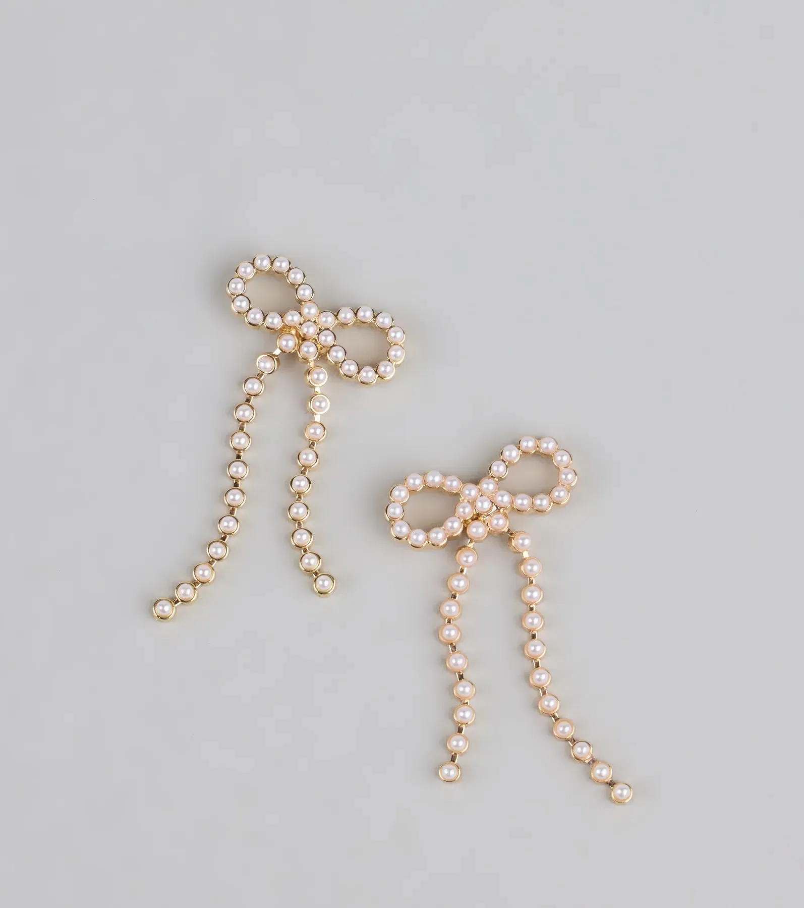 Dainty Poise Faux Pearl Bow Earrings sold by Windsor