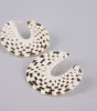 Sun Chaser Woven Raffia Hoop Earrings sold by Windsor