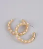Statement Mode Pearl Hoop Earrings sold by Windsor