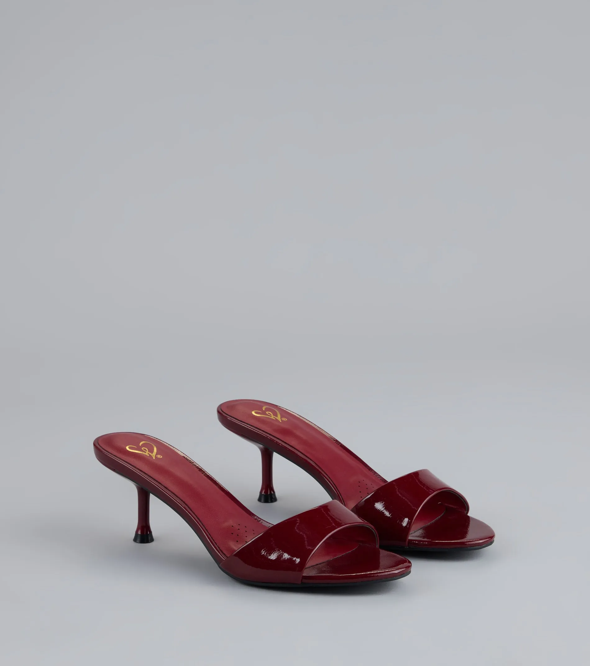 Own the Moment Patent Heeled Mules sold by Windsor