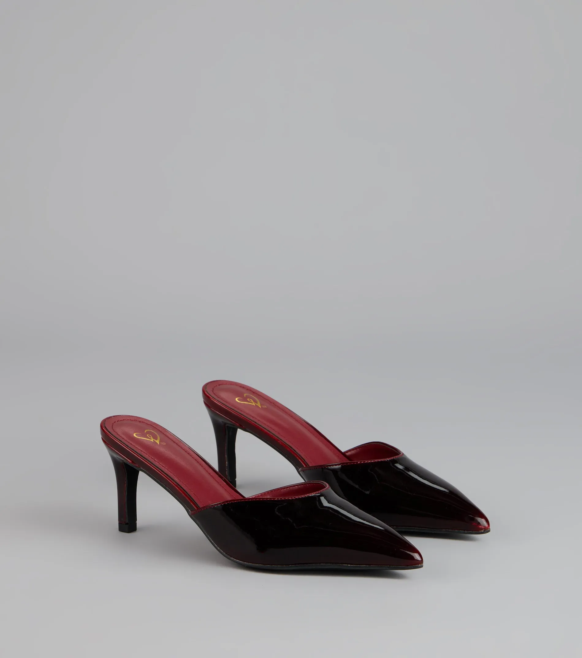 Polished Intent Patent Mules sold by Windsor