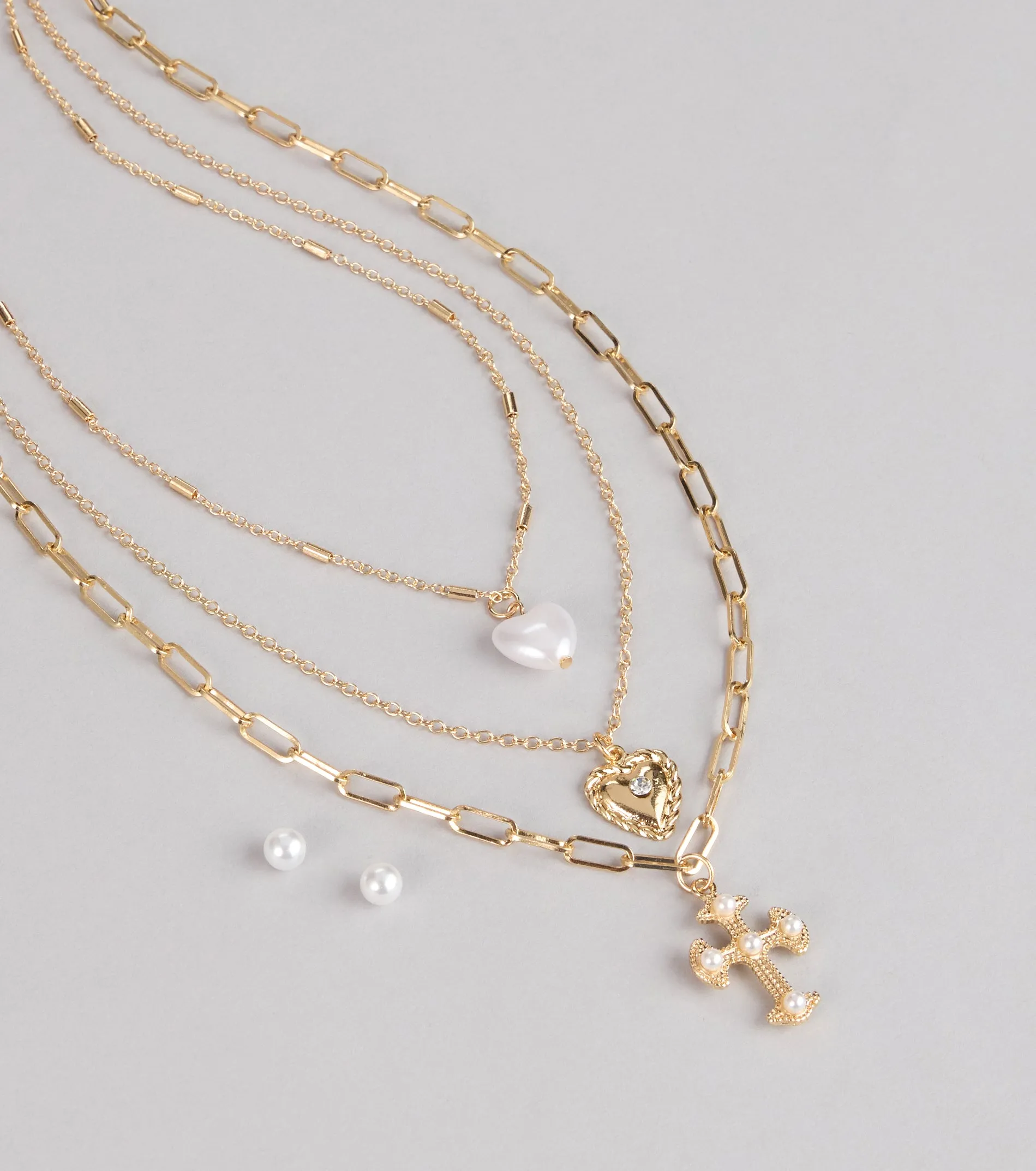 Heart And Charm Layered Necklace Set sold by Windsor