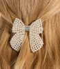 Charming Hour Faux Pearl Bow Hair Clip sold by Windsor