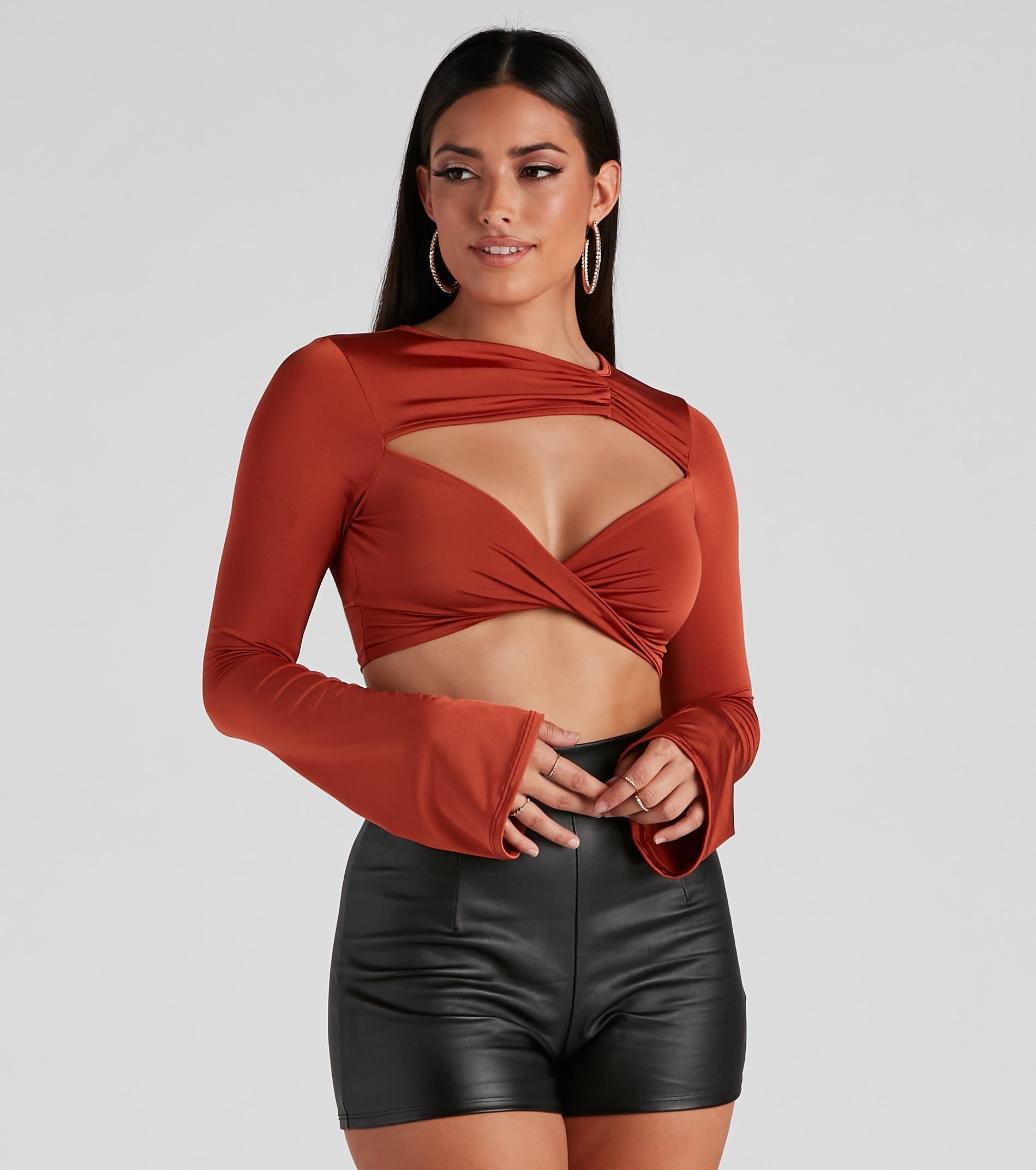 Rising Temps Twist Cutout Crop Top sold by Windsor