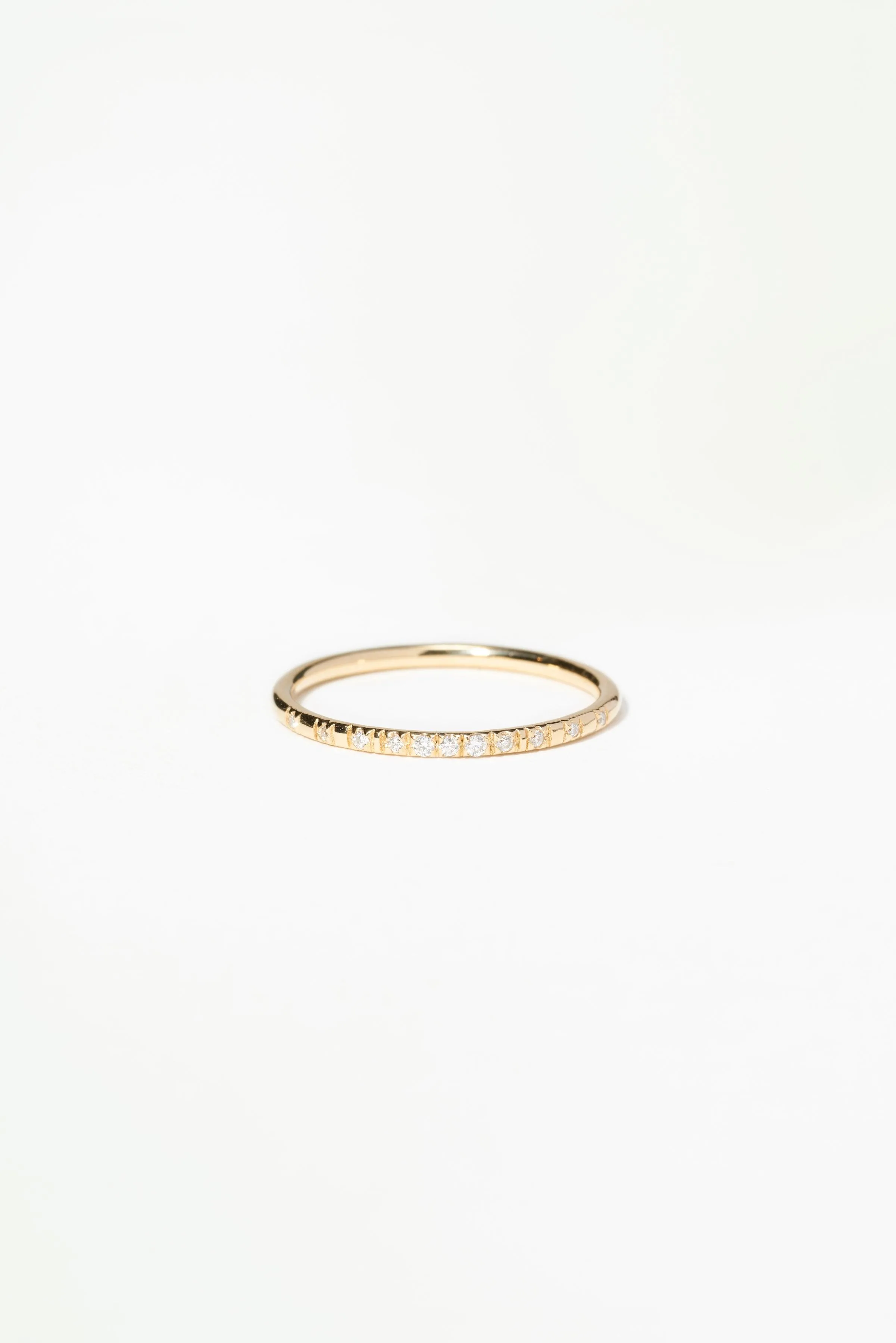 Small Micropave Diamond Graduated Band sold by WWAKE