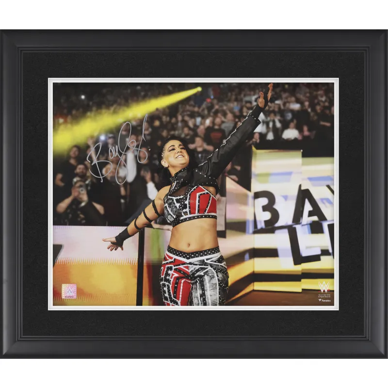 Bayley WWE Autographed Framed 16" x 20" Entrance Arms Out Photograph sold by WWE