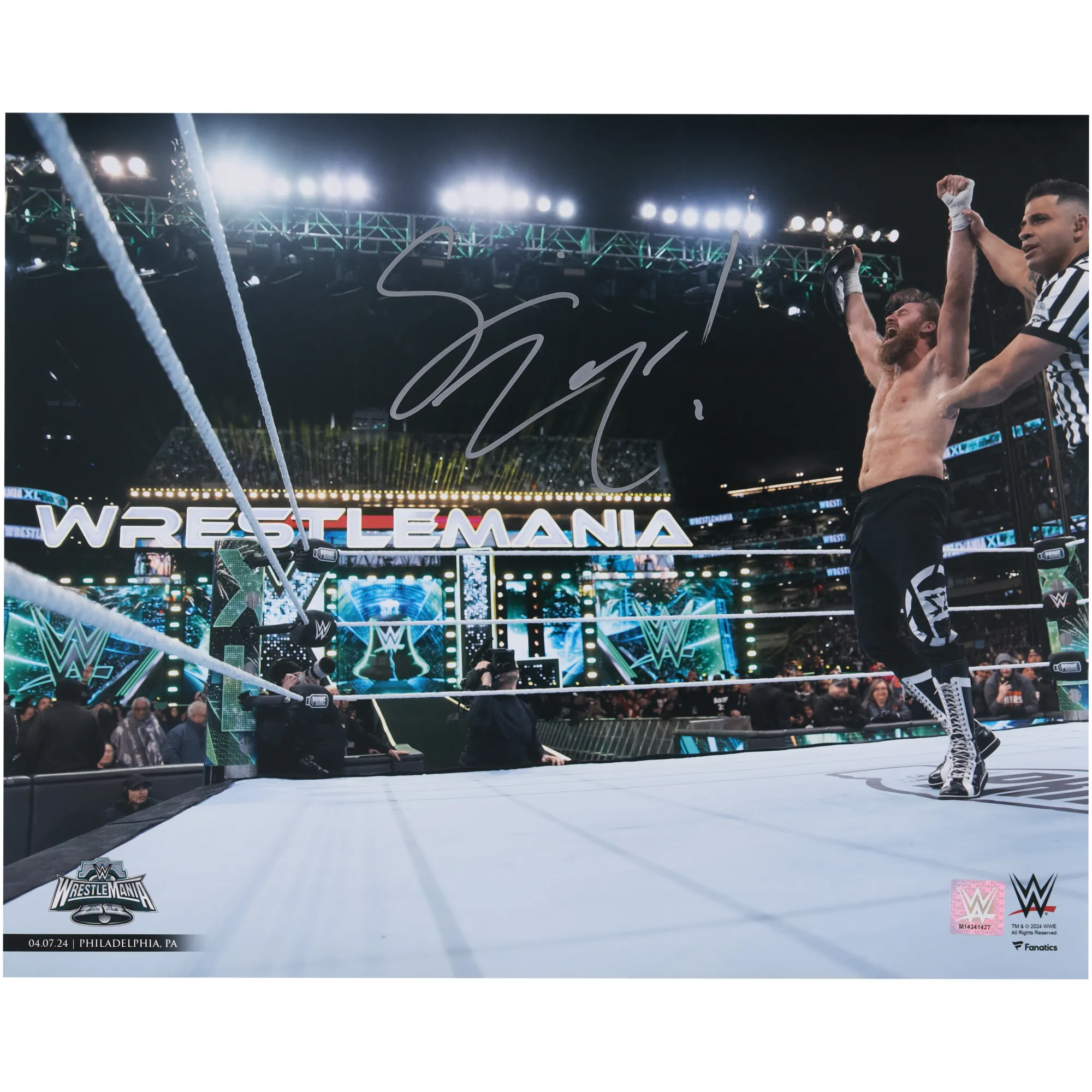 Sami Zayn WWE Autographed 16" x 20" WrestleMania XL Raising Title Belt Photograph sold by WWE