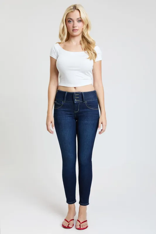 Women's Luxe Mid Rise 3-Button WannaBettaButt Skinny Jeans sold by YMI