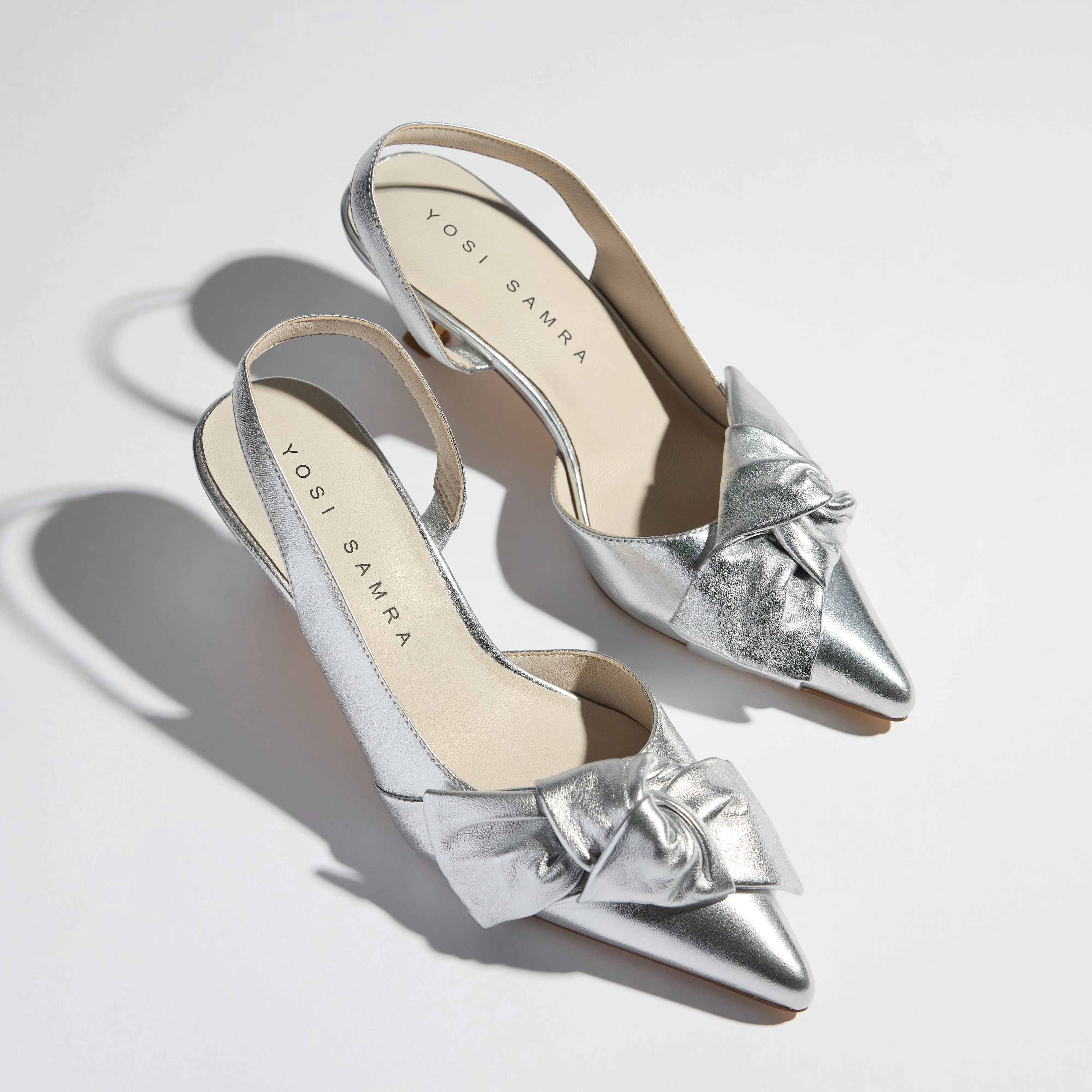 Kaleigh Bow Heel in Silver Leather sold by Yosi Samra