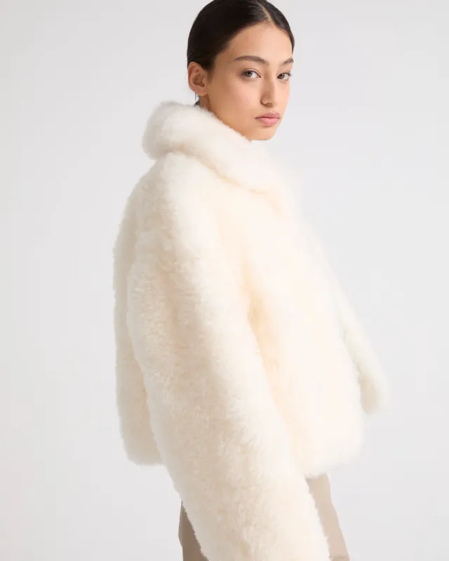 Veste courte en agneau cachemire frisé sold by Yves Salomon