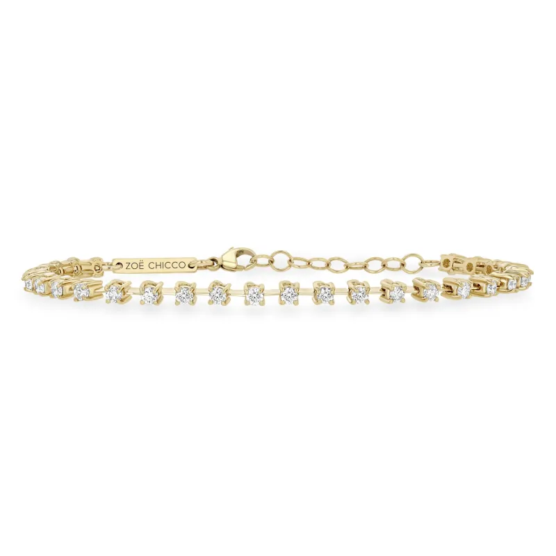 14k Prong Diamond Dash Tennis Bracelet sold by Zoe Chicco