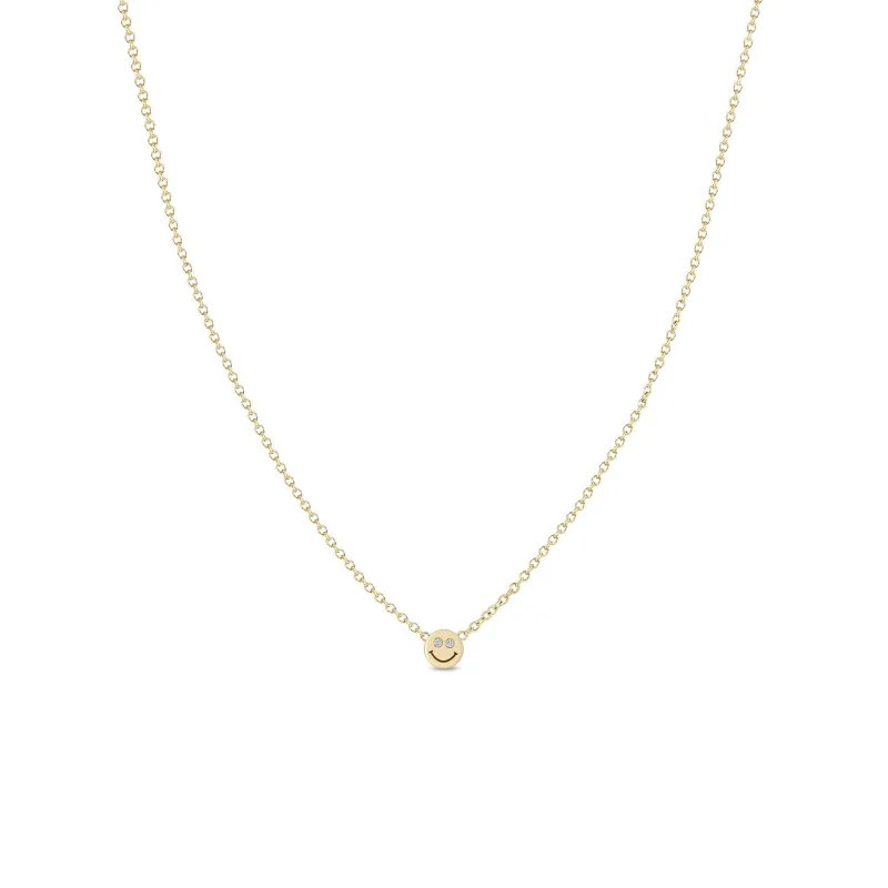 14k Itty Bitty Smiley Face with Diamond Eyes Necklace sold by Zoe Chicco