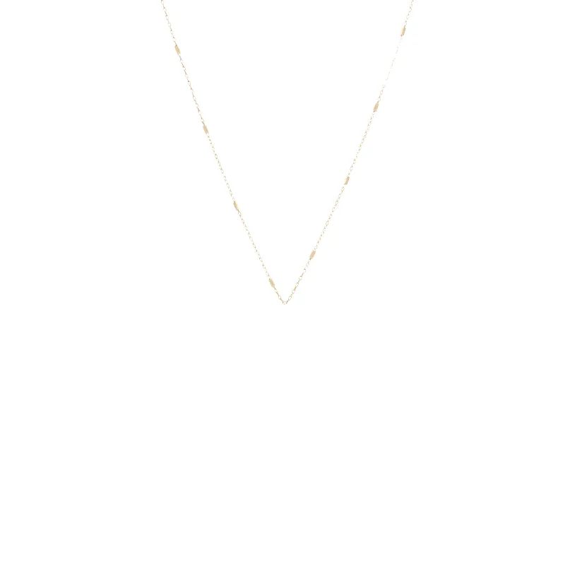 14k tiny bar cable chain sold by Zoe Chicco