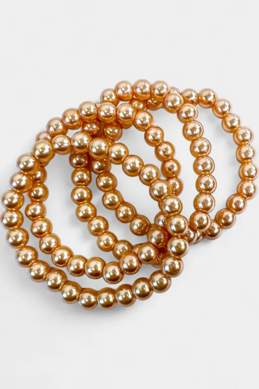Tangerine Pearl Stretch Bracelets sold by ZZs