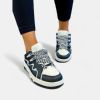 Black & White Racer Sneakers sold by ZZs