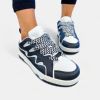 Black & White Racer Sneakers sold by ZZs