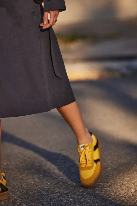 Yellow and black Colette sneakers sold by Balzac Paris