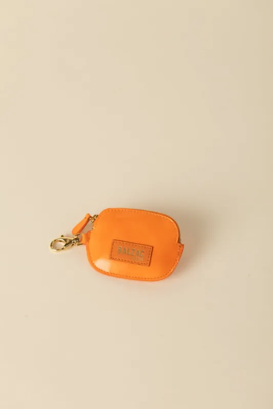 Varnished orange carabiner Ziggy coin purse sold by Balzac Paris