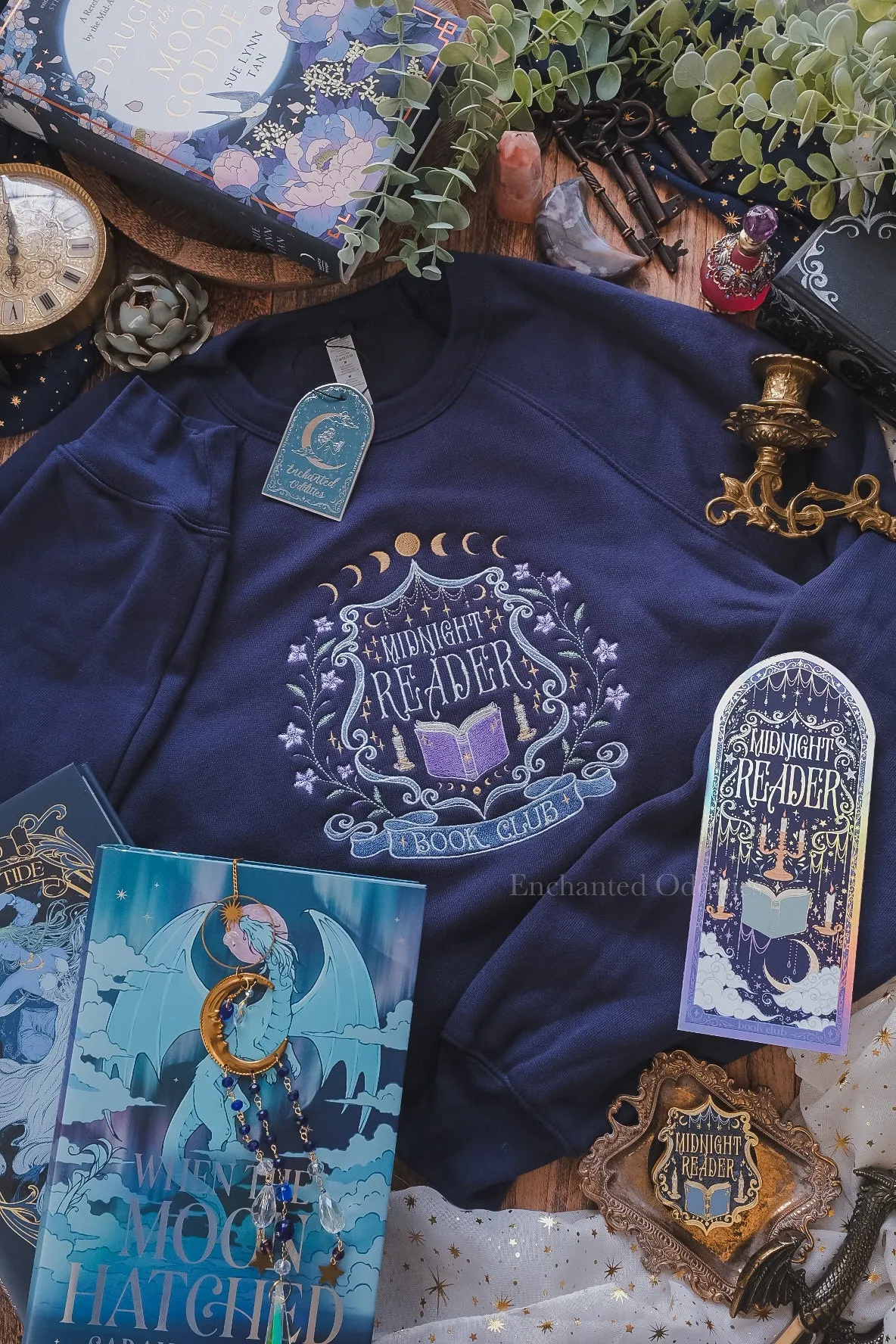 Midnight Reader crewneck sold by Enchanted Oddities