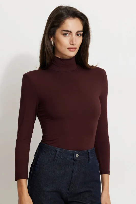 Shoulder Pad Mock Neck Top sold by Dynamite