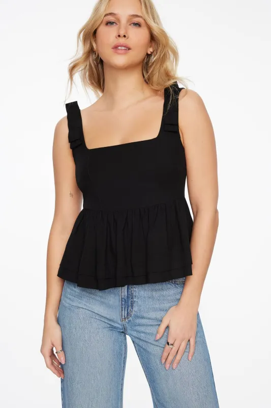 Bow Peplum top sold by Dynamite