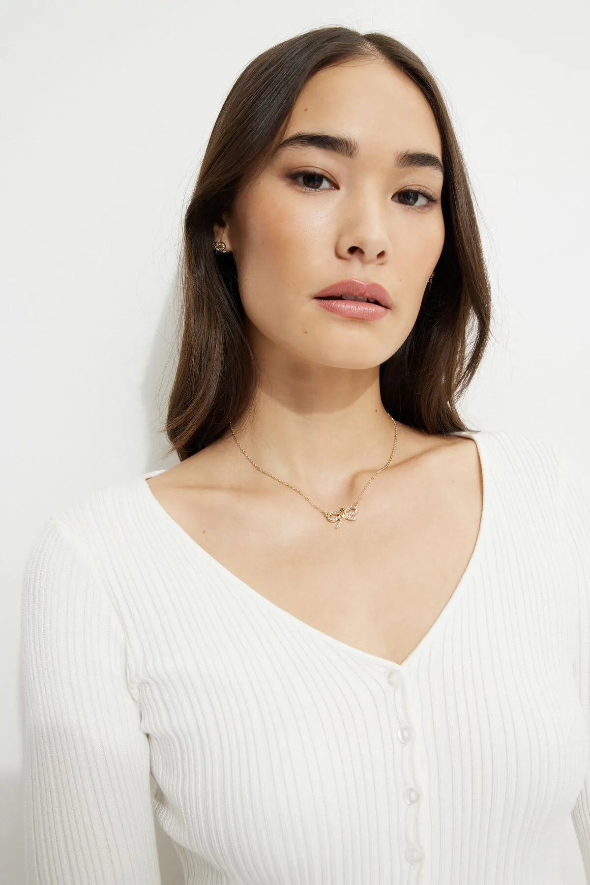 Gem Knotted Bow Necklace sold by Dynamite