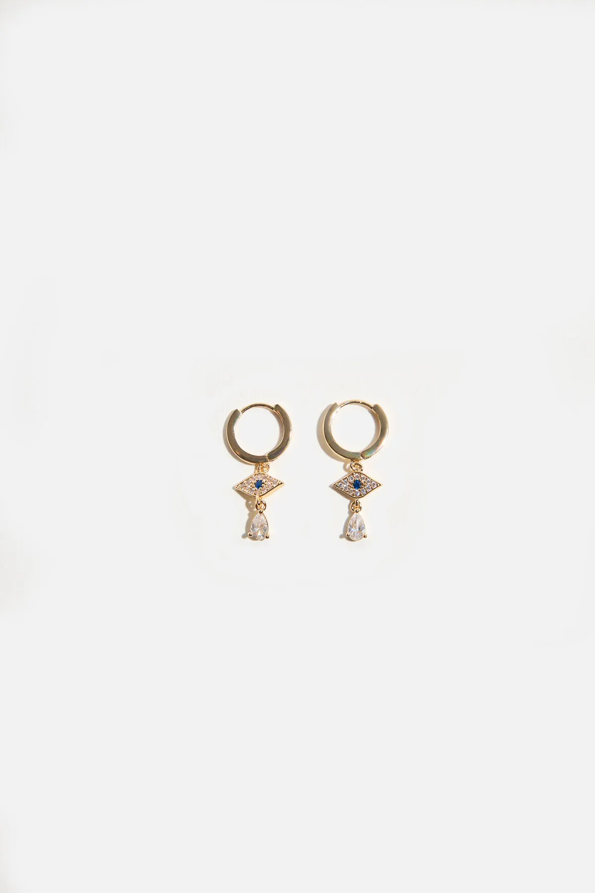 Evil Eye Huggie Earrings sold by Dynamite