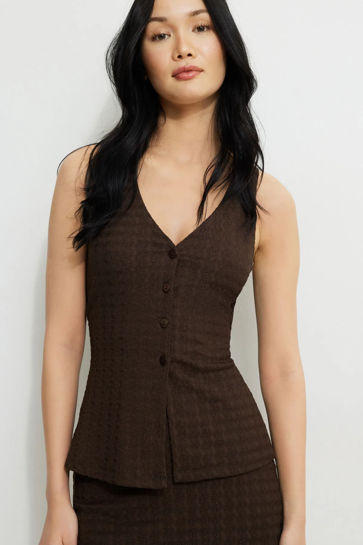 Textured V Neck Flyaway Vest sold by Dynamite