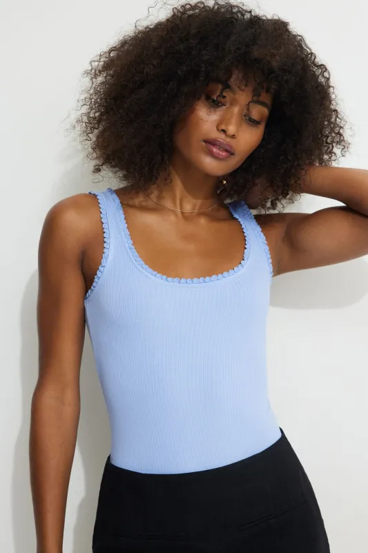 Ribbed Ruffle Trim Bodysuit sold by Dynamite