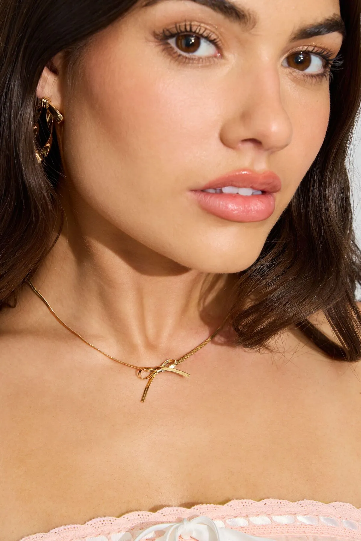 Snake Chain Bow Necklace sold by Garage