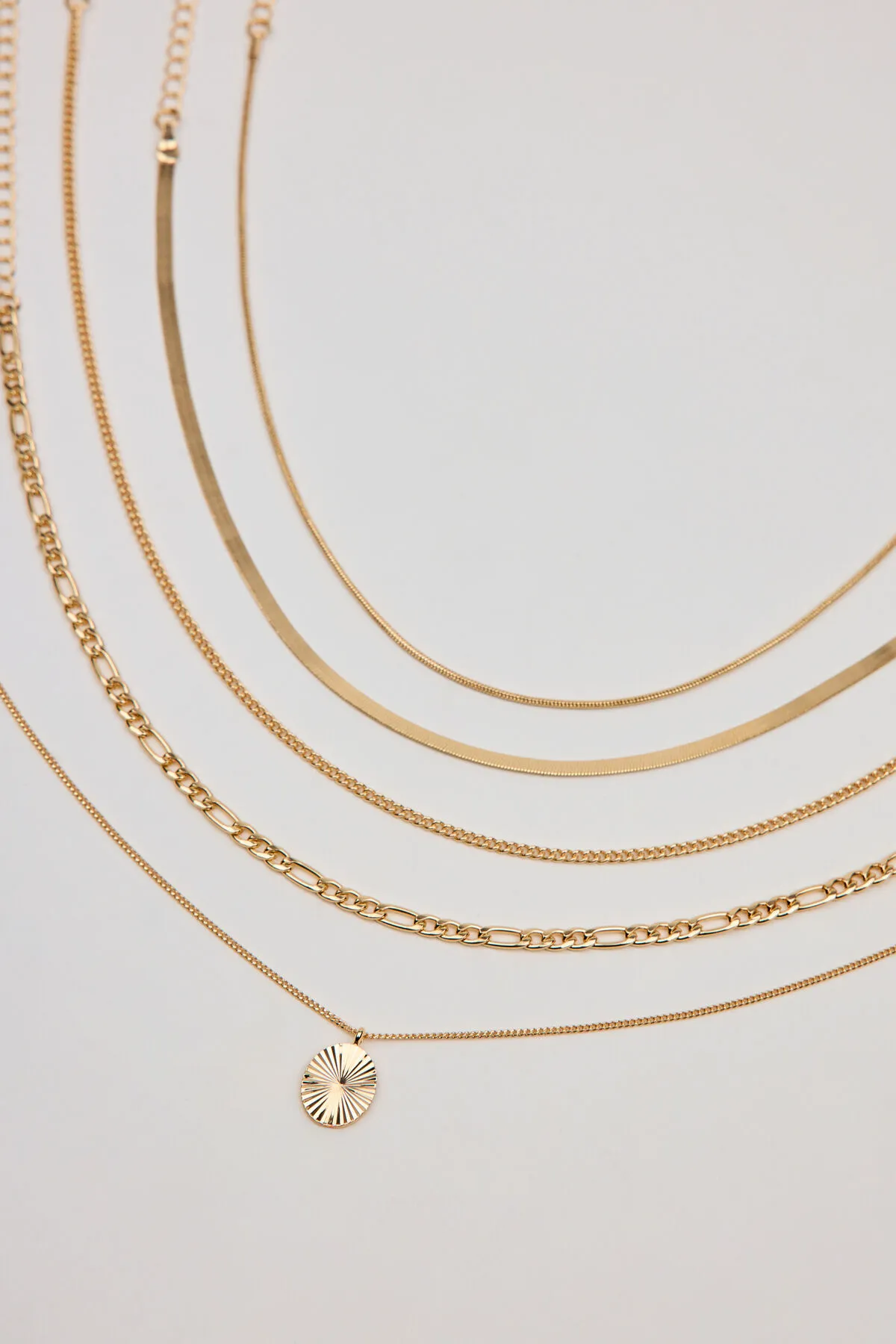 Set of 5 Clean Diamond Cut Oval Necklaces sold by Garage