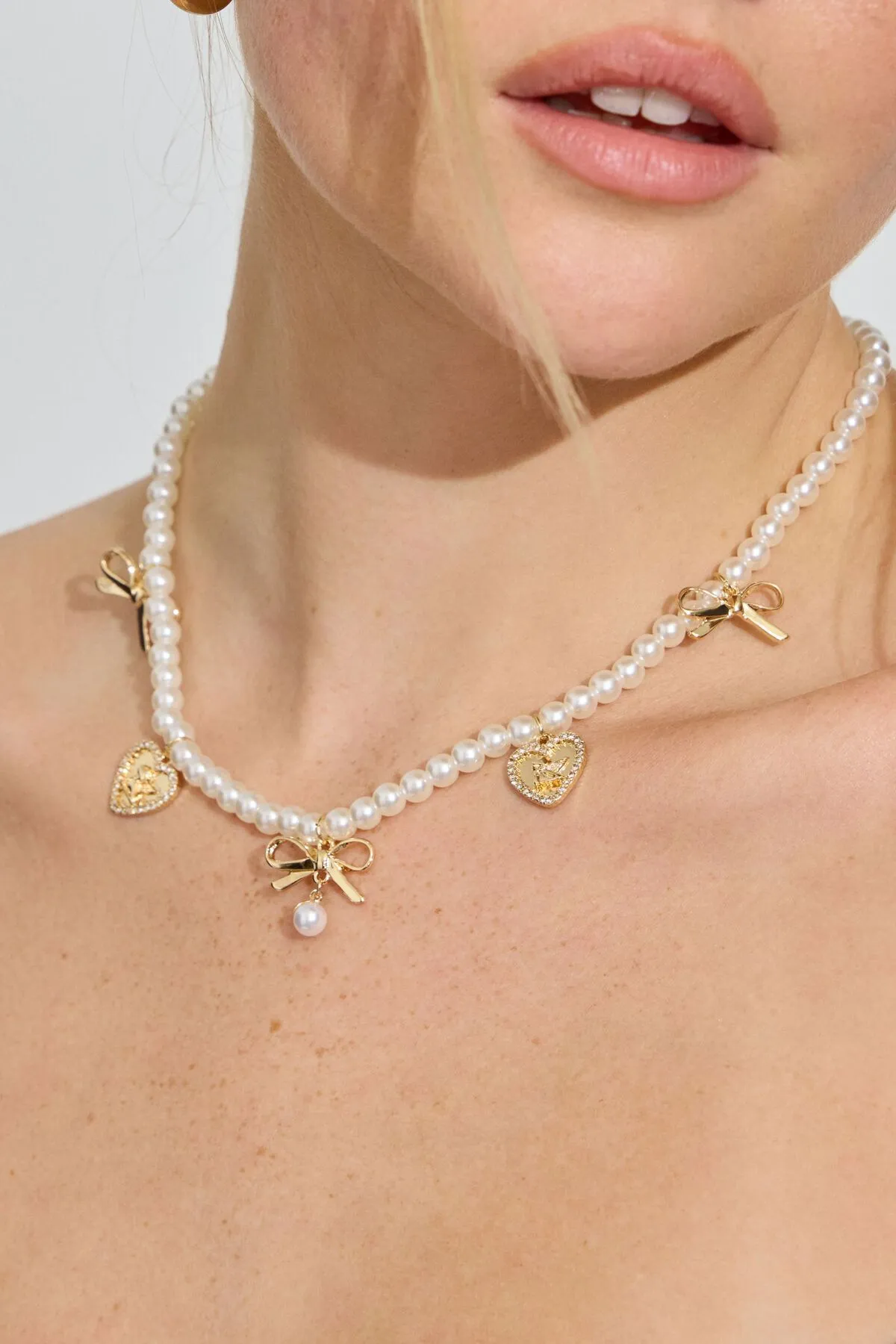 Pearly Bows & Heart Necklace sold by Garage