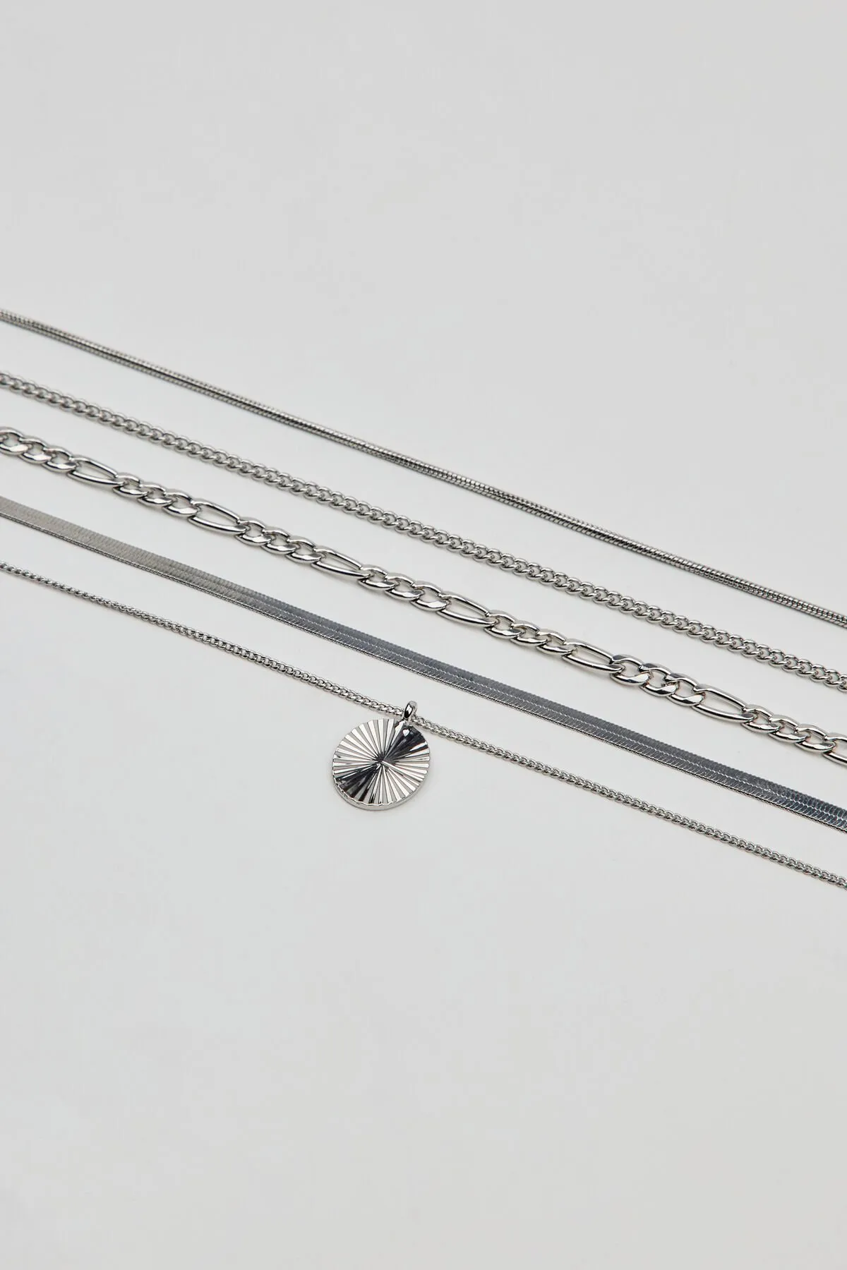 Set of 5 Clean Diamond Cut Oval Necklaces sold by Garage