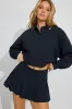 Pique Pleated Active Skort sold by Garage