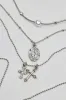 Set of 3 Pearl, Cross, and Pendant Necklaces sold by Garage