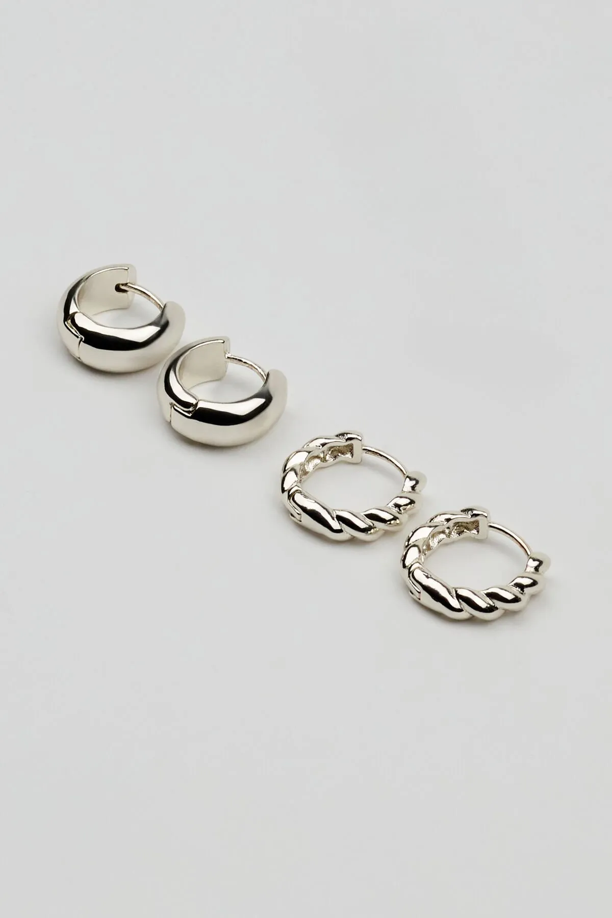 2 Pack Twisted & Smooth Huggy Earrings sold by Garage