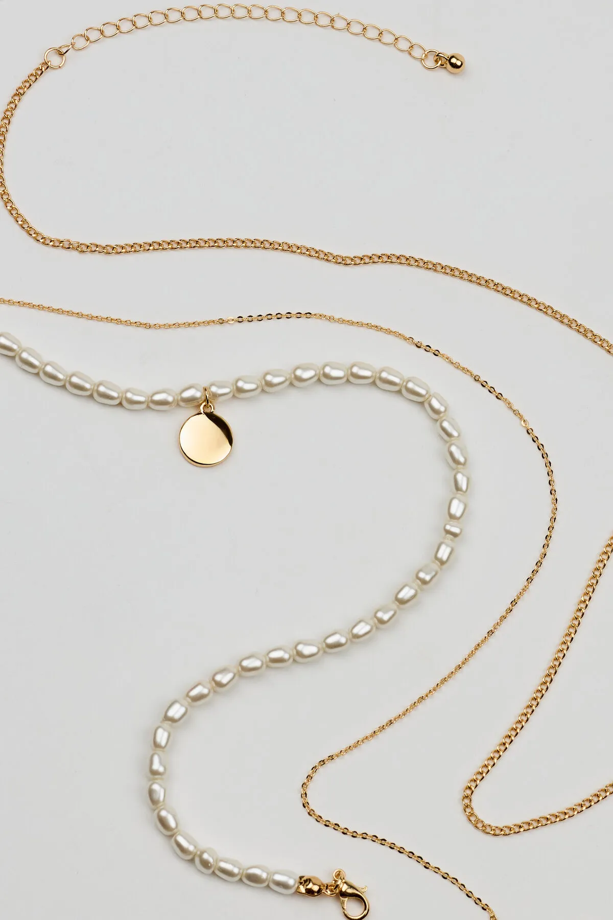 Set of 3 Pearl and Chain Necklaces sold by Garage