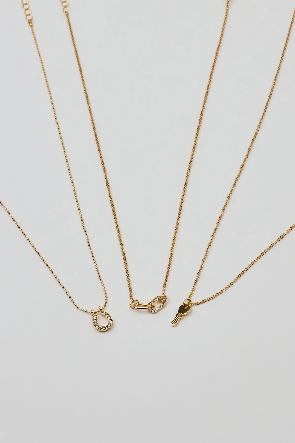 Set of 3 Key, Shoehorn & Link Necklaces sold by Garage
