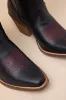 Queen A Hearts Black Leather Knee-High Western Boots sold by Lulus