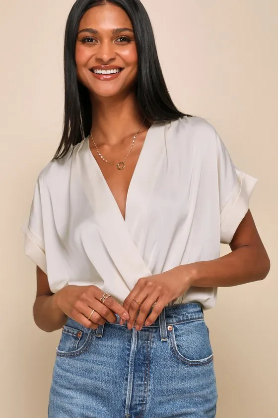 Posh Precision Champagne Satin Surplice Short Sleeve Bodysuit sold by Lulus