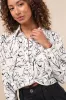 Artsy Attitude White Floral Collared Twist Hem Button-Up Top sold by Lulus