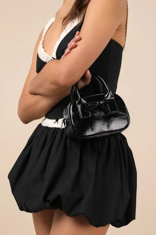 Laleh Black Vegan Leather Bow Crossbody Bag sold by Lulus