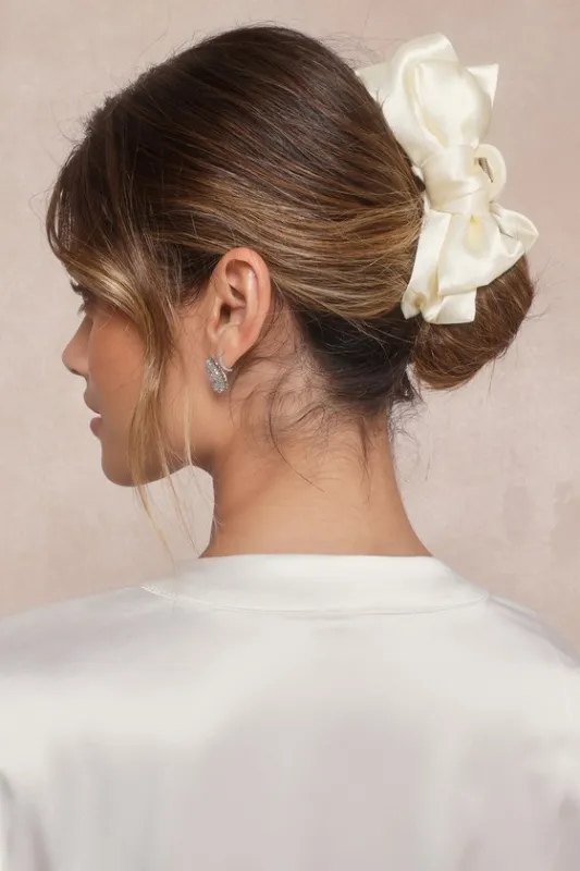 Sleek Conclusion Ivory Bow Claw Hair Clip sold by Lulus