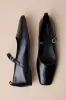 Delia Black Leather Buckle Ballet Flats sold by Lulus