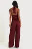 Confident Impression Burgundy Satin Pleated Halter Jumpsuit sold by Lulus