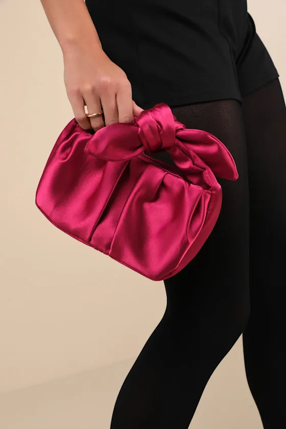Essential Style Magenta Satin Knot Handle Clutch Bag sold by Lulus