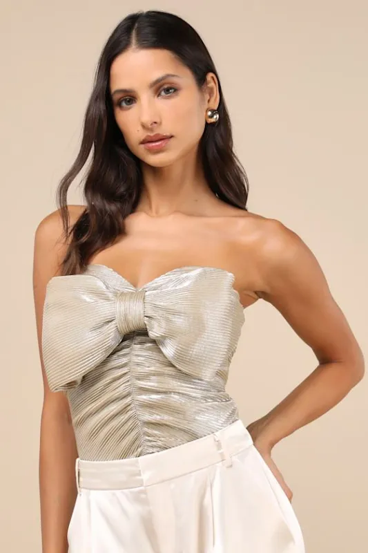 Fashionista Flair Shiny Champagne Bow Strapless Top sold by Lulus