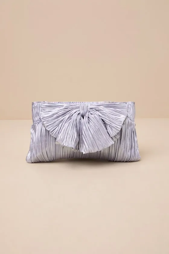Odilia Lavender Lurex Pleated Bow Clutch sold by Lulus